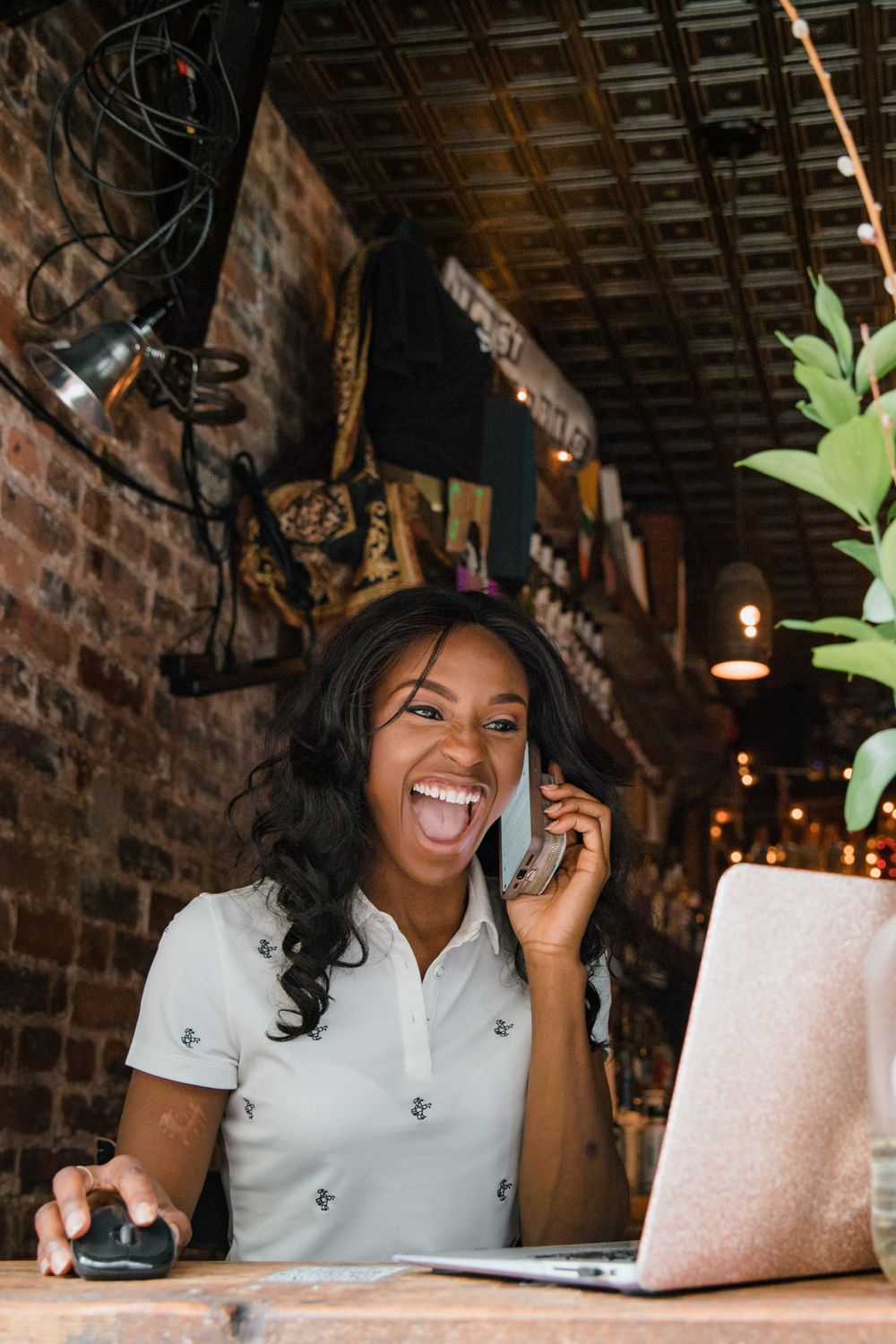 A small business owner working at a laptop