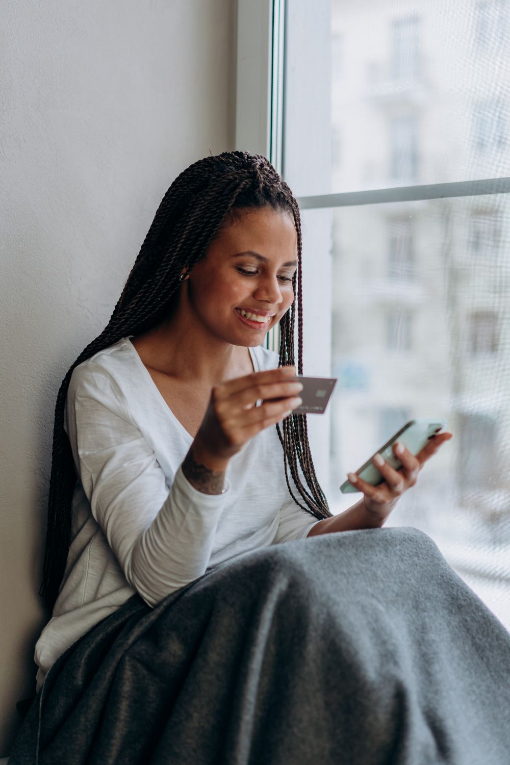 A shopper paying on a phone