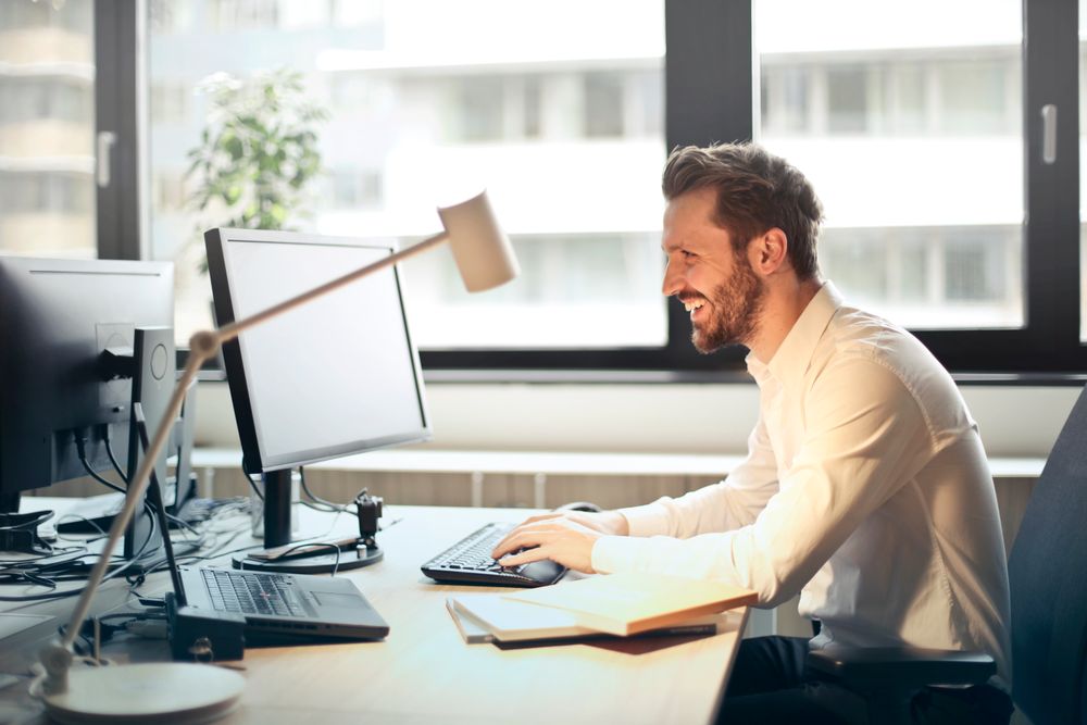 Someone reading email at a desk