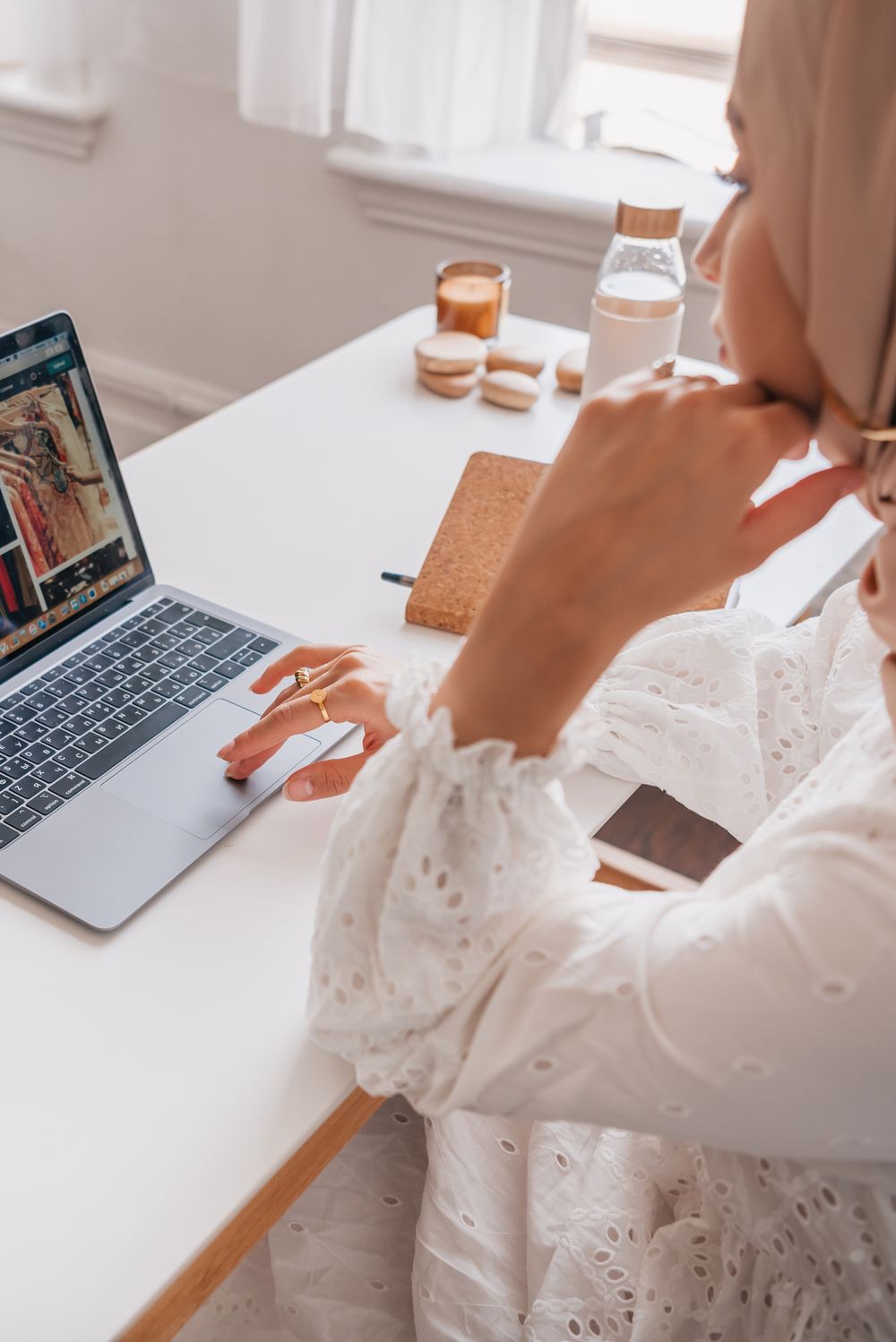 A shopper browsing a store on a laptop